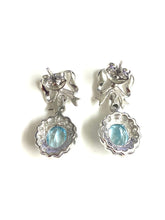 9ct White Gold Blue Topaz and Diamond Bow Earrings