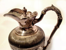 Ornate Silver Pitcher