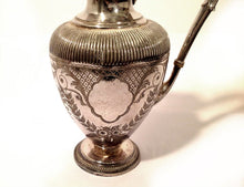 Ornate Silver Pitcher