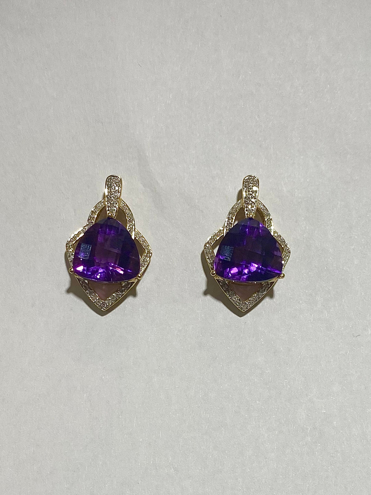 Vintage 7 Carat Amethyst Stud Earrings set in 14 carat Yellow Gold and surrounded by Diamonds