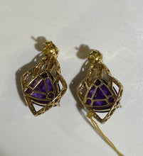 Vintage 7 Carat Amethyst Stud Earrings set in 14 carat Yellow Gold and surrounded by Diamonds