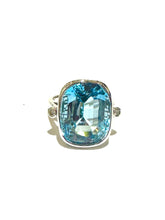 9ct White Gold Ring set with a Faceted Blue rounded baguette Topaz