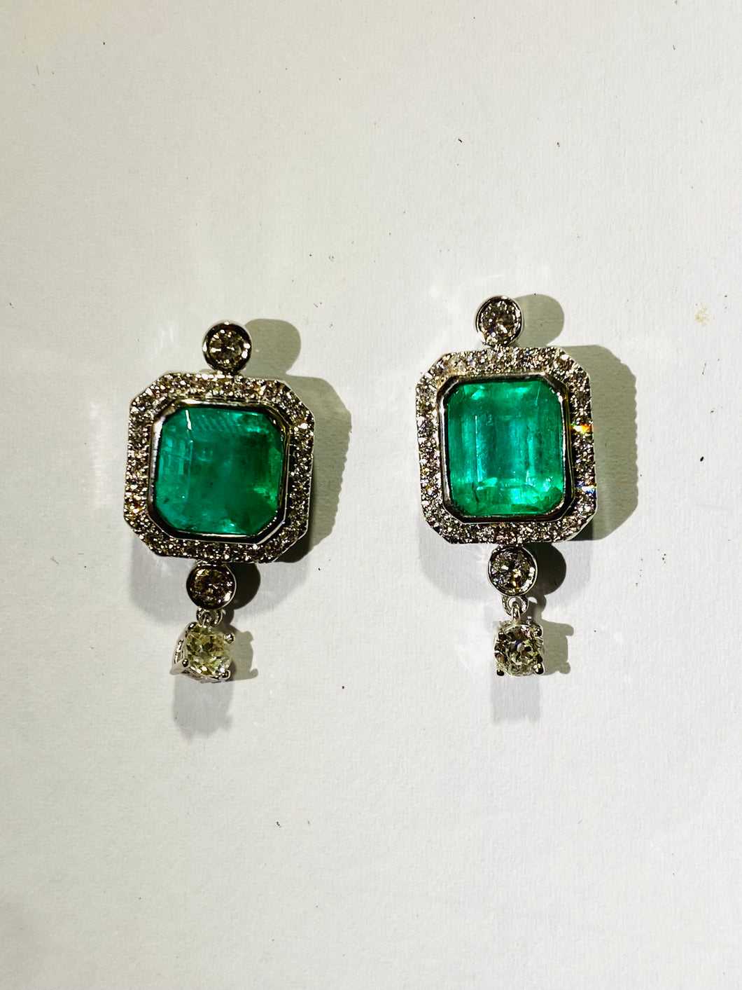 9 carat white gold diamond and emerald set square cut stud drop earrings $16,500