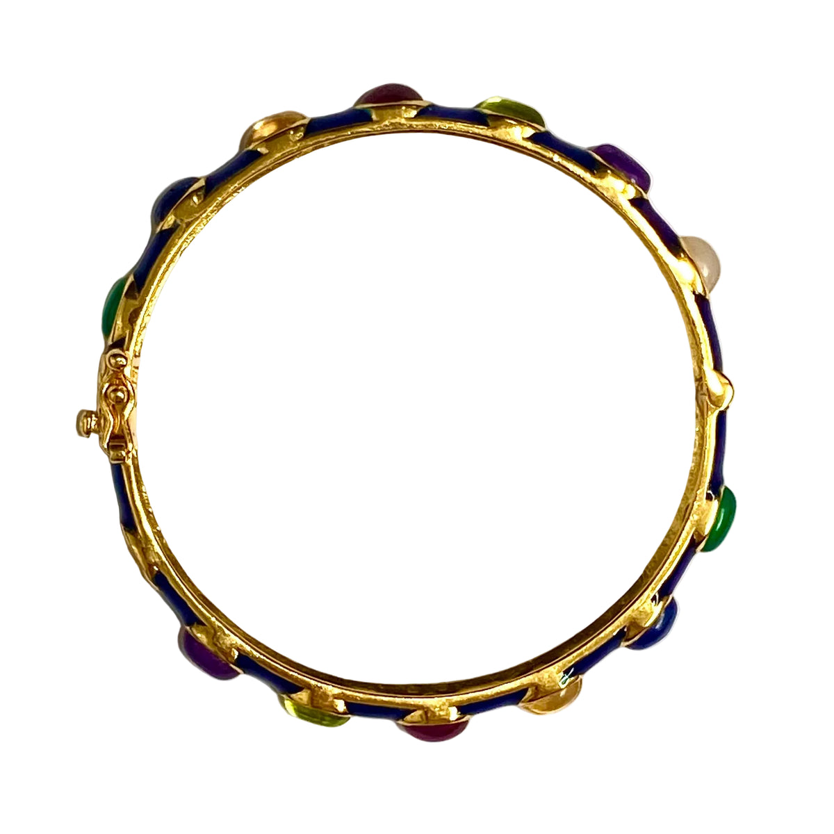 A gold-plated bangle bracelet featuring a dark blue enamel inlay and small colorful stone accents in green, purple, and red, shown on a plain white background.