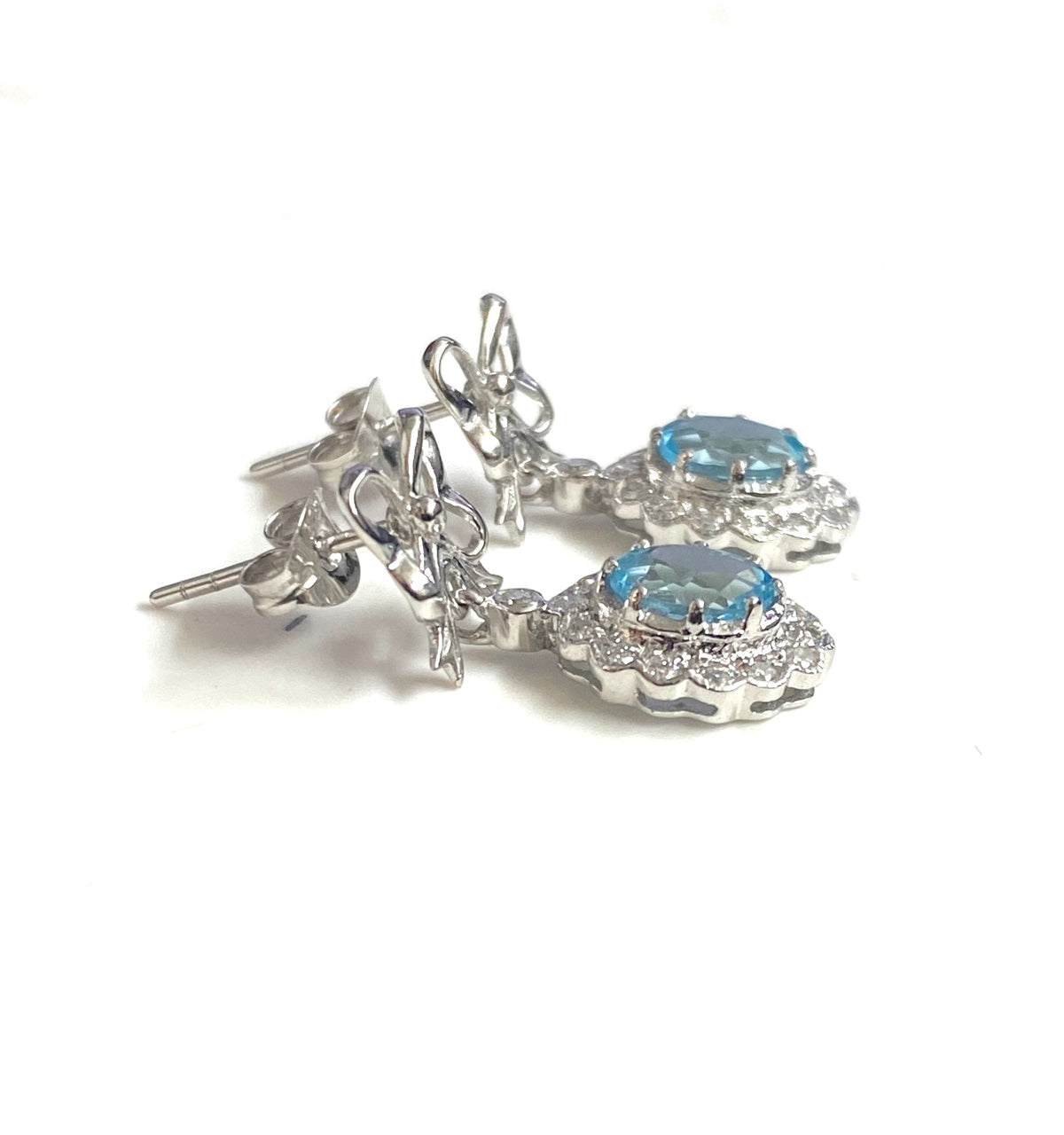 9ct White Gold Blue Topaz and Diamond Bow Earrings