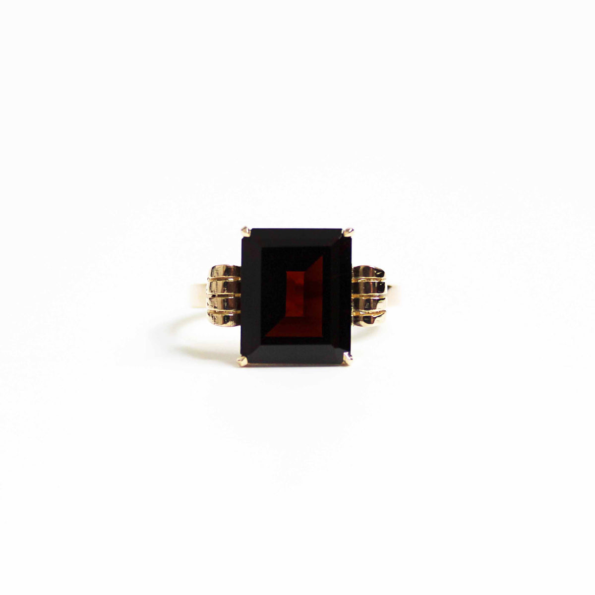 Art Deco Style Garnet Ring With Elaborate Side Scrolls