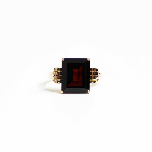 Art Deco Style Garnet Ring With Elaborate Side Scrolls