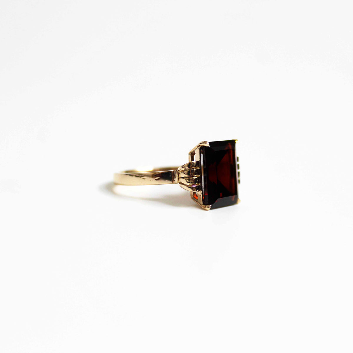 Art Deco Style Garnet Ring With Elaborate Side Scrolls