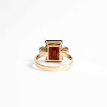 Art Deco Style Garnet Ring With Elaborate Side Scrolls