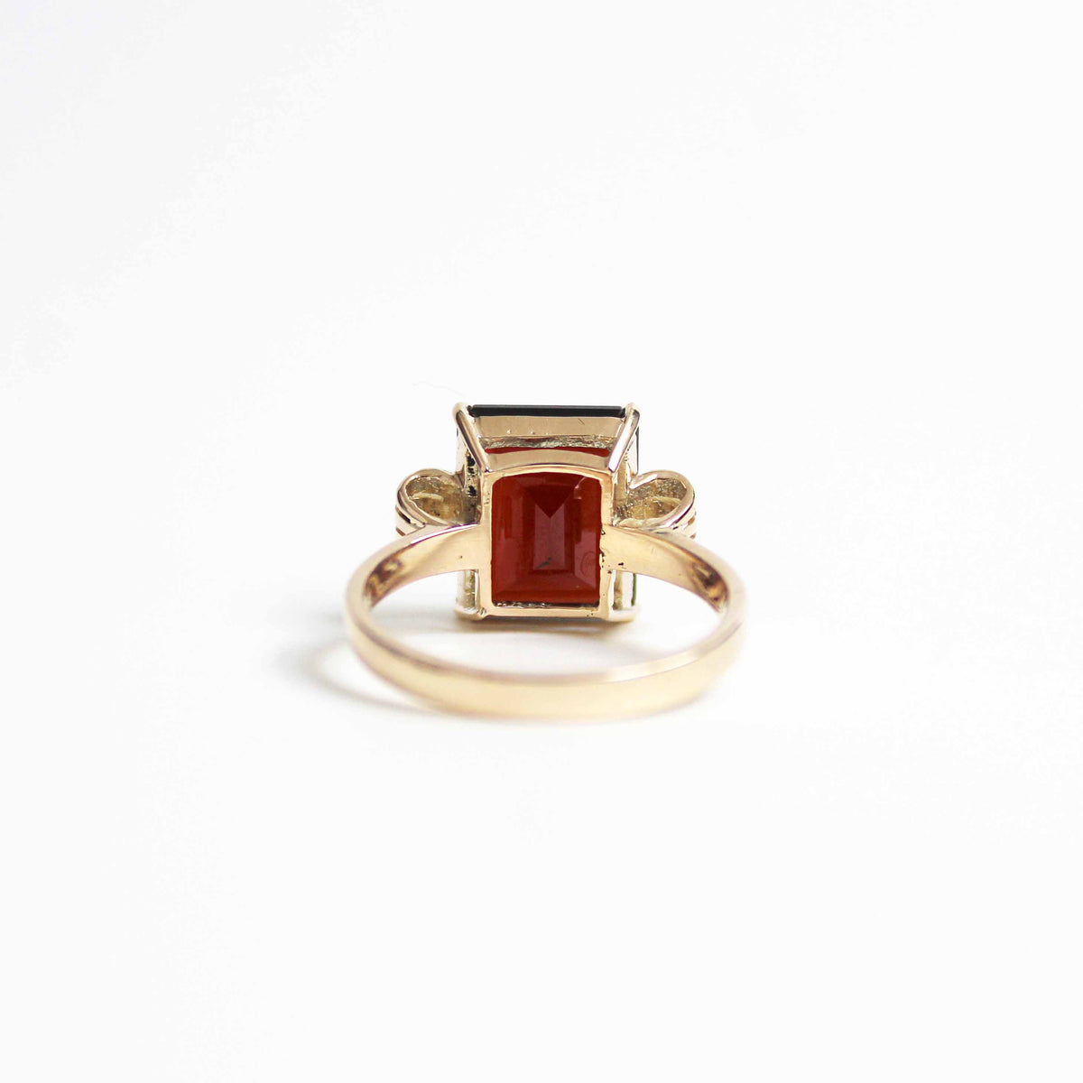 Art Deco Style Garnet Ring With Elaborate Side Scrolls