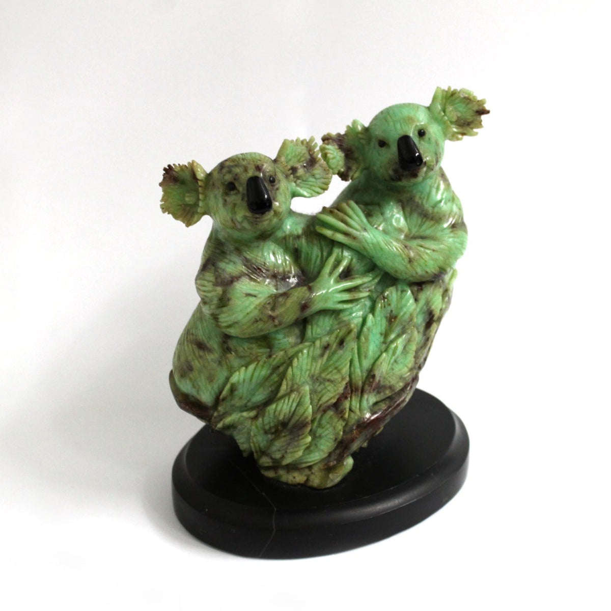 Hand Carved Chrysoprase Koalas set on an Onyx base