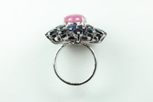 Sterling Silver Cabochon Ruby With Surrounding Sapphires Ring