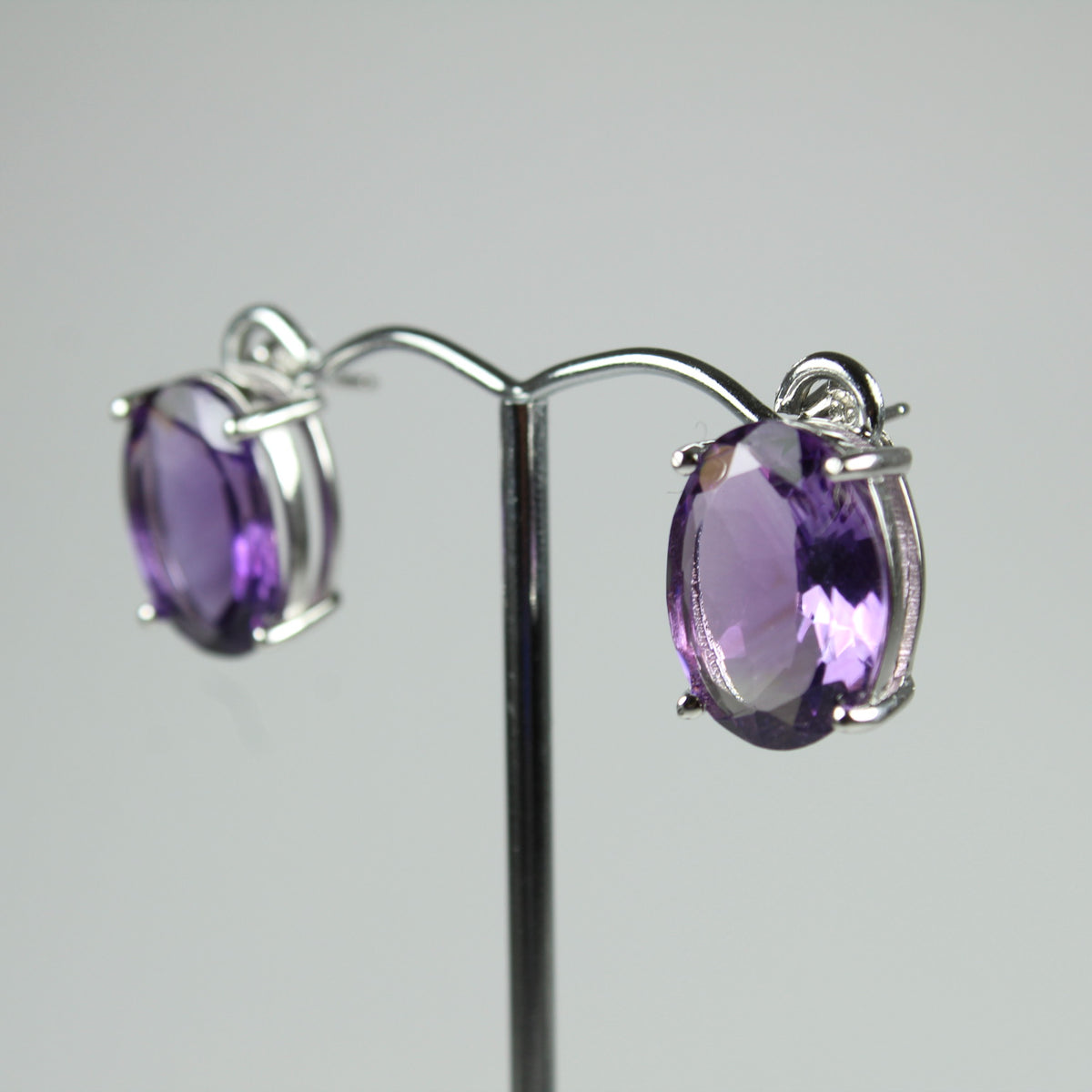 Sterling Silver Oval Cut Purple Amethyst Studded Earrings